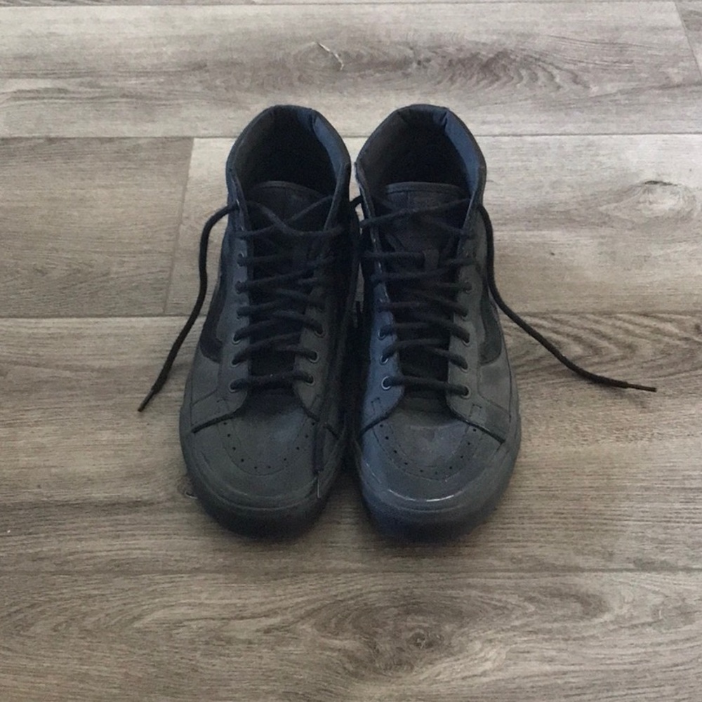 All black Vans leather sk8 high top